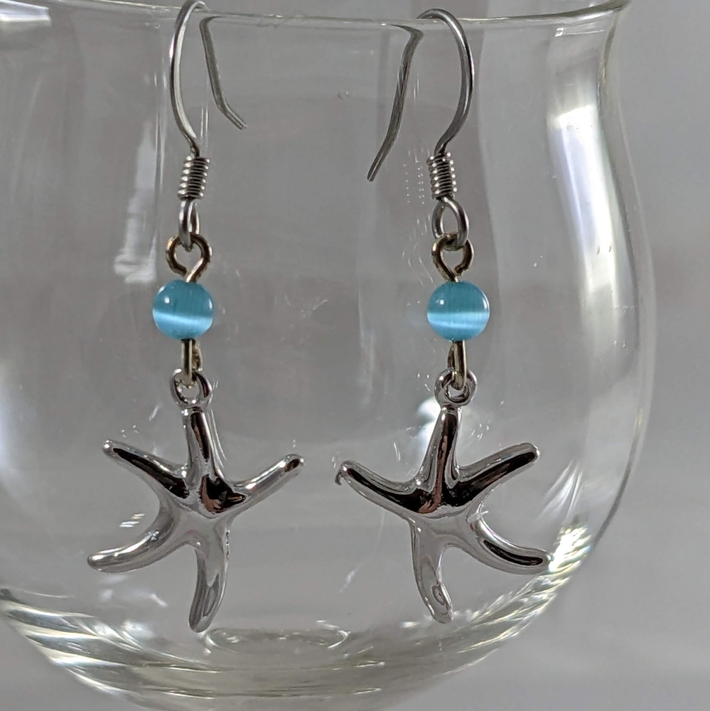 Dancing Starfish earrings with blue cats eye. Made in the USA